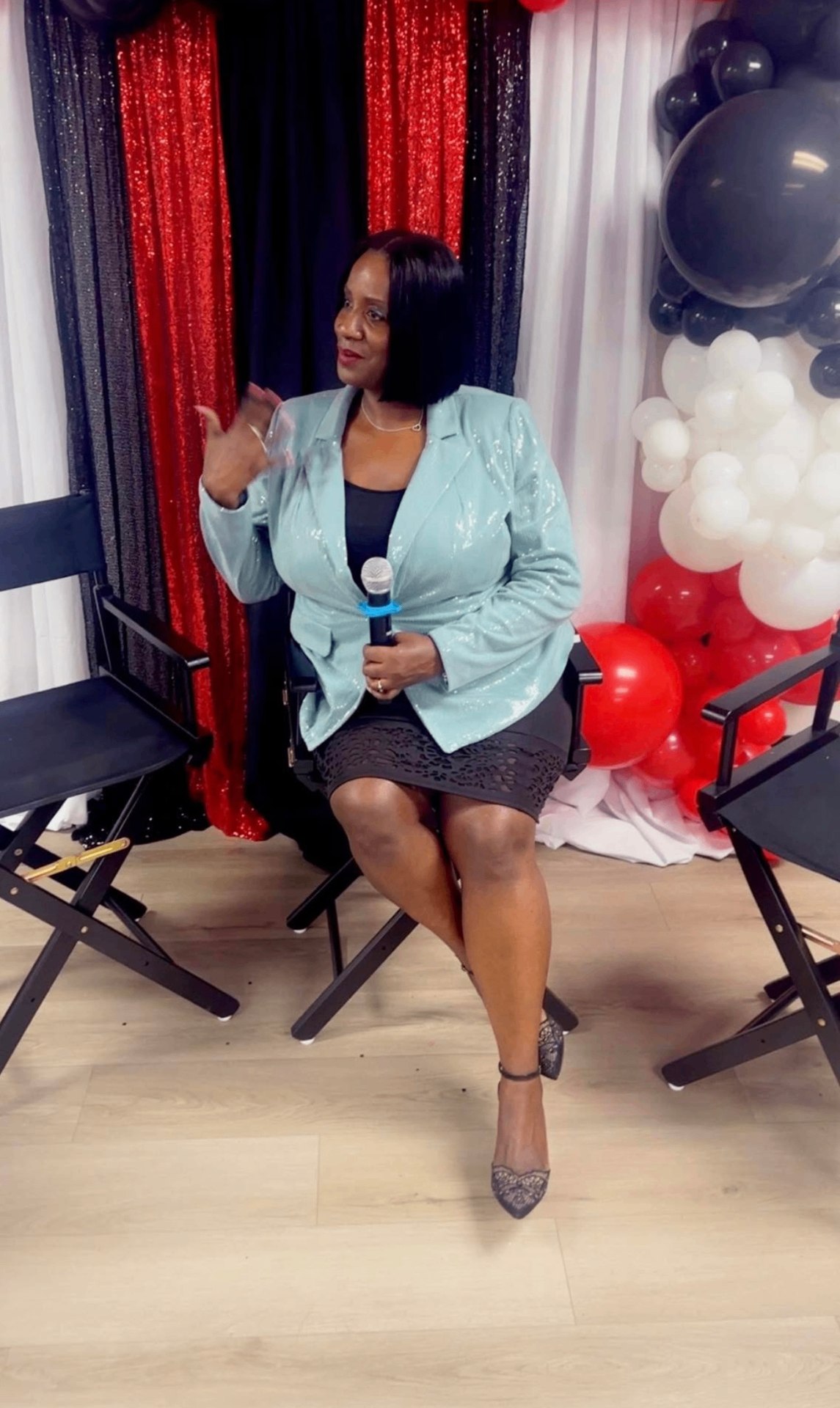 Tinzley Bradford speaking with a microphone at a live panel